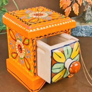 “Hand-painted wooden box with a pull-out blue pottery ceramic drawer in floral design, crafted by Kanhaiya Handicrafts.”