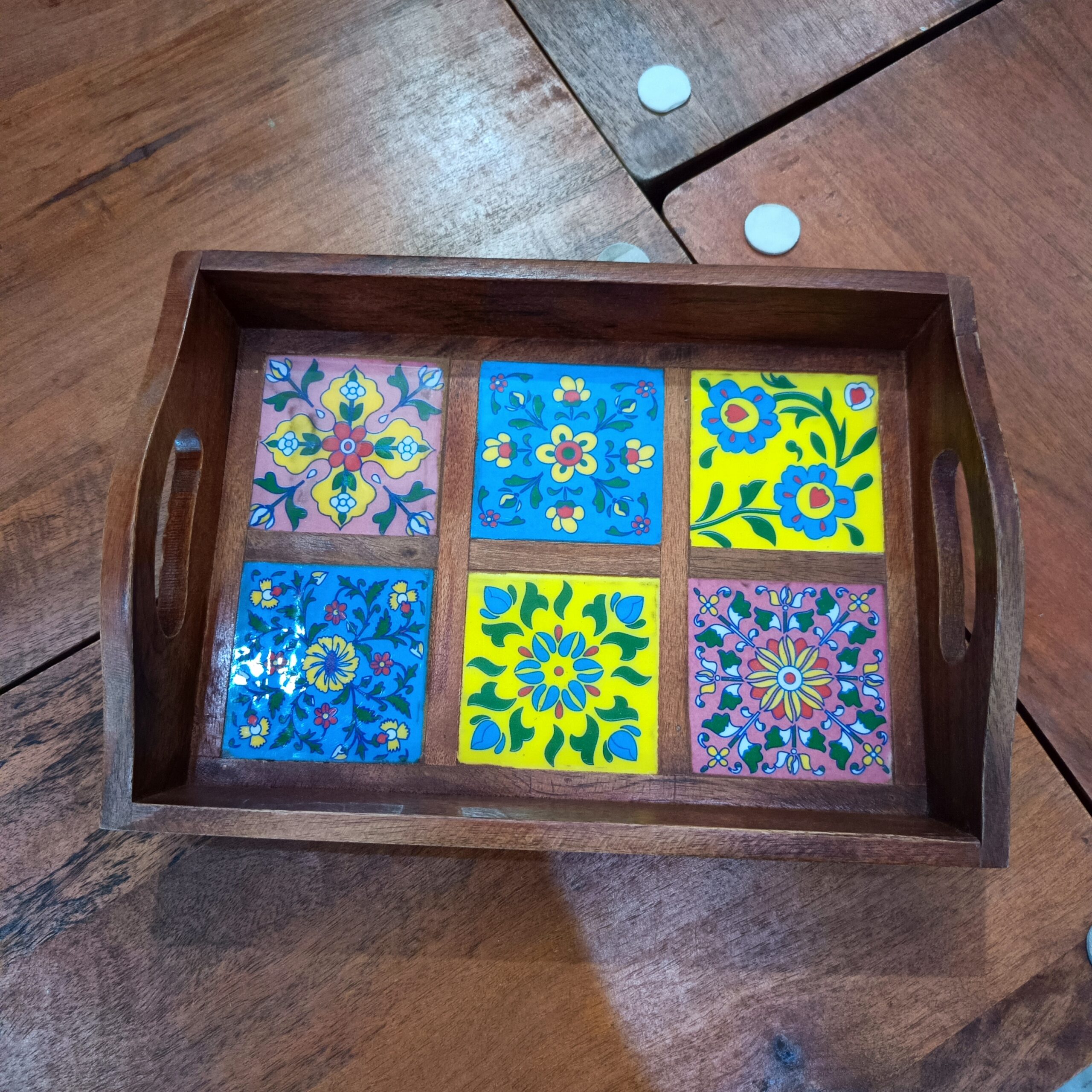 Handcrafted wooden serving tray with six colorful blue pottery tiles in floral and geometric designs, made by Kanhaiya Handicrafts.