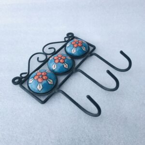 Handmade Blue Pottery cloth hook with floral ceramic knobs on a black iron frame – Kanhaiya Handicrafts